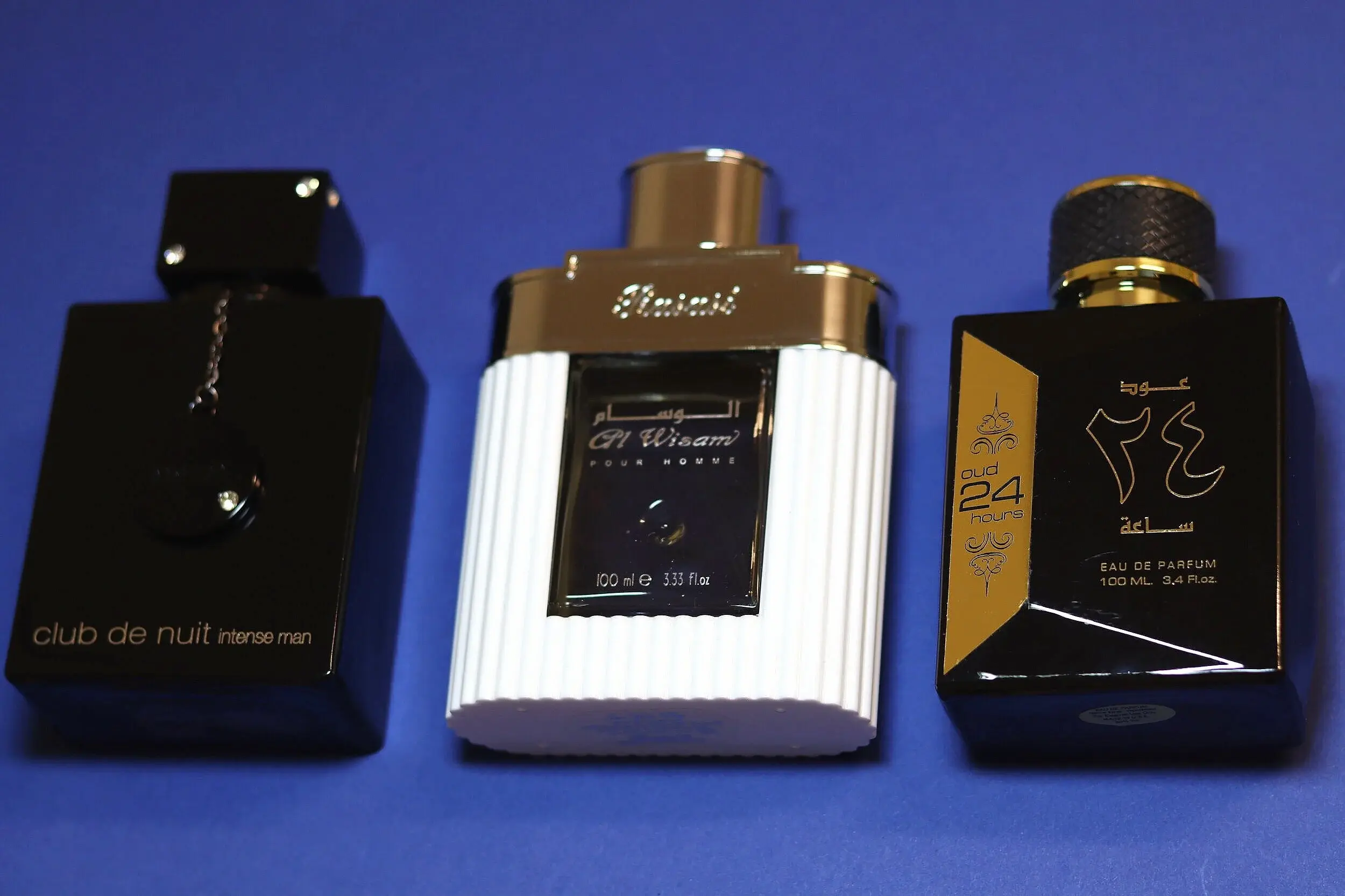 Three fragrance bottles side by side
